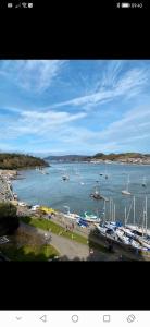 a view of a harbor with boats in the water at Netherton Studio Apartment 1 in Llandrillo-yn-Rhôs