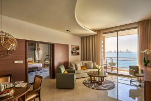 a living room with a couch and a table at Marina Hotel in Kuwait