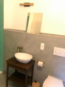 a bathroom with a sink and a toilet at Bahnhof Nebra in Nebra