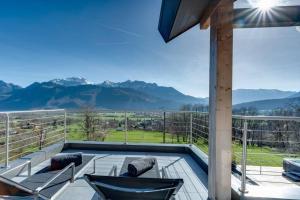 a balcony with a view of the mountains at Villa Bamboo in Lathuile