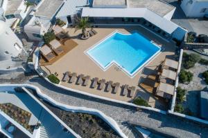 an overhead view of the pool at a resort at Strogili in Oia