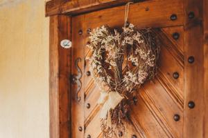 a wreath hanging on a wooden door at Boutique Apartmán Speicher in Prague