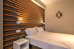 En eller flere senge i et værelse på Avatel Eco Lodge