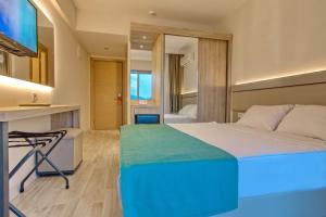 Postel nebo postele na pokoji v ubytování Palmea Hotel