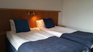 Postel nebo postele na pokoji v ubytování Hotell City