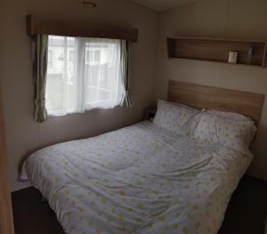 Ένα ή περισσότερα κρεβάτια σε δωμάτιο στο Daisie