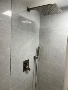 a shower in a bathroom with a glass door at Camp Lake Bear in South Colton