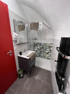 a bathroom with a sink and a shower at A Cola in Rocchetta Nervina