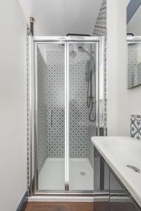 a shower with a glass door in a bathroom at North Laine Boutique in Brighton & Hove