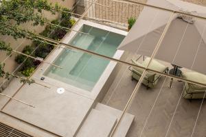 an overhead view of a building with a swimming pool at Casa do Fontanário Stay in Amarante