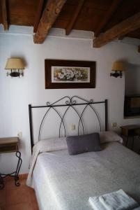 a bedroom with a large bed in a room at Casas Rurales Los Cortijos in Alcaraz +45 photos
