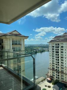 a view of a river from the balcony of a building at Cozzzy hut @ Riverine Diamond Kuching in Kuching