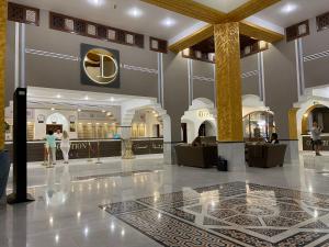 a lobby of a shopping mall with a clock on the wall at Sheikh coast in Sharm El Sheikh