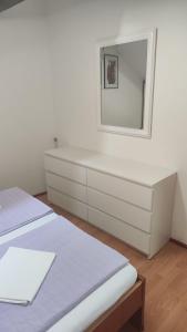 Postel nebo postele na pokoji v ubytování Apartments Suri