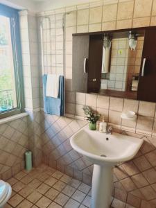 a bathroom with a sink and a mirror at Mosè House in Formia