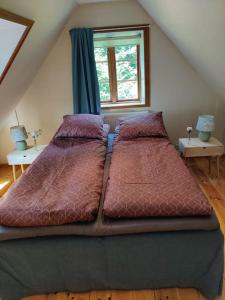Postel nebo postele na pokoji v ubytování Stuga i natursköna mittskåne