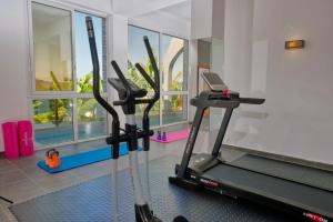 a gym with a treadmill and a window at Andriana Resort & Spa in Nosy Be
