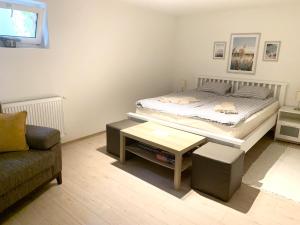 Posteľ alebo postele v izbe v ubytovaní Pommedi Apartman