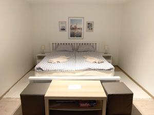 Posteľ alebo postele v izbe v ubytovaní Pommedi Apartman