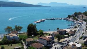 a town on the shore of a large body of water at Polyxenis Rooms in Lygia