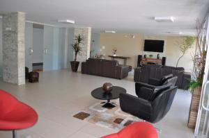 Uma TV ou centro de entretenimento em Hotel CTC