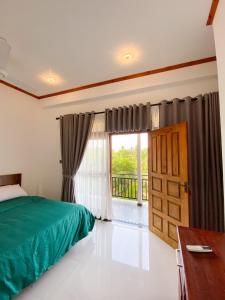 Letto o letti in una camera di The Reef Resort