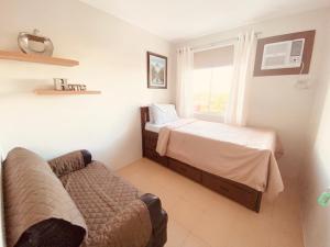 Ένα ή περισσότερα κρεβάτια σε δωμάτιο στο Aimee Exquisite Spaces