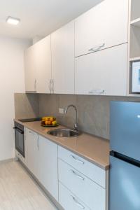Kuchyň nebo kuchyňský kout v ubytování Apartman Krželj B3