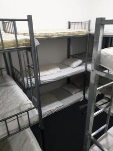 a group of bunk beds in a room at Dubai Hostel, Bedspace and Backpackers in Dubai
