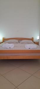 Säng eller sängar i ett rum på Romantica Apartments