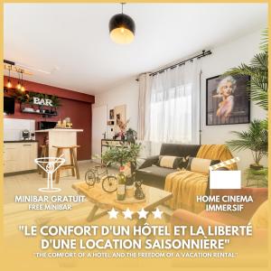 a living room with a couch and a table at Le Prestige* * * * - Minibar Gratuit - Parking in Saint-Pierre