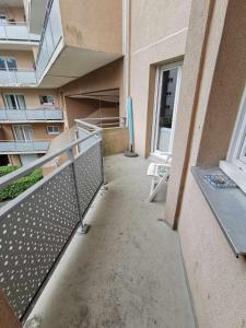 a balcony of an apartment building with a railing at Appartement Noisiel 77 (proche Disneyland & Paris) in Noisiel