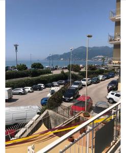 a parking lot with cars parked in a parking lot at Blue Sea Salerno in Salerno