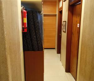 a hallway of a room with a fire hydrant at Bentley Hotel, Marine Drive in Mumbai