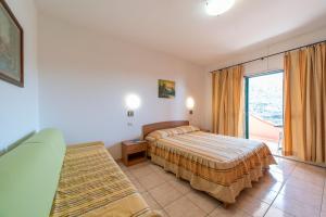 A bed or beds in a room at Villetta Grazia