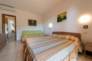 A bed or beds in a room at Villetta Grazia