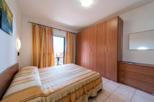 A bed or beds in a room at Villetta Grazia