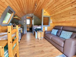 a living room and kitchen in a tiny house at Bothan Creag Sobhrag in Ballachulish