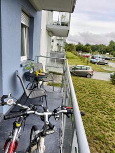 a bike parked on the balcony of a house at Luksusowy Apartament Mario Mare Kołobrzeg in Kołobrzeg
