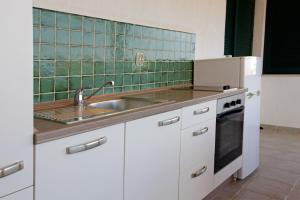 Kuchyňa alebo kuchynka v ubytovaní Apartments Mel