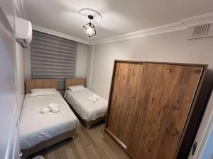 Postel nebo postele na pokoji v ubytování Laras Homes 2+1 Antalya