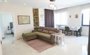a living room with a couch and a table at Alanya City Tower sea&mountain view in Alanya
