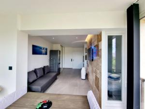 Posezení v ubytování Appartement moderne et confort + 5 fotografií