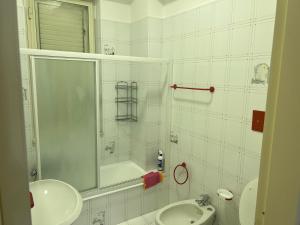 a bathroom with a shower and a sink and a toilet at Casa Giancontieri in Marinella di Selinunte