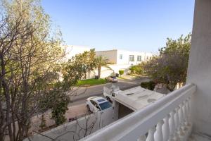 a white truck parked on the side of a street at Relaxing Private Rooms in Compound Housing near Burj Alarab Villa 124 in Dubai