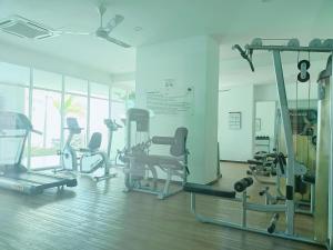 a gym with several treadmills and exercise bikes at Deluxe Suites 4, 2-5 pax, Netflix, Georgetown in Jelutong