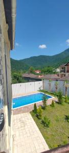 a swimming pool in a yard next to a building at Luxury Millionere villa in Gabala