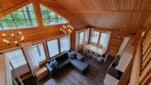 an overhead view of a living room and dining room in a house at Villa Aurora, Himos in Jämsä +29 photos