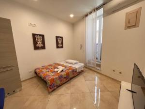 Postel nebo postele na pokoji v ubytování Esse House's Noto