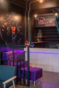 a bar with a gorilla painted on the wall at Black Panther Hostel in Phuket